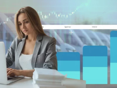 A girl is working in front of a computer and calculates the tco of the fleet